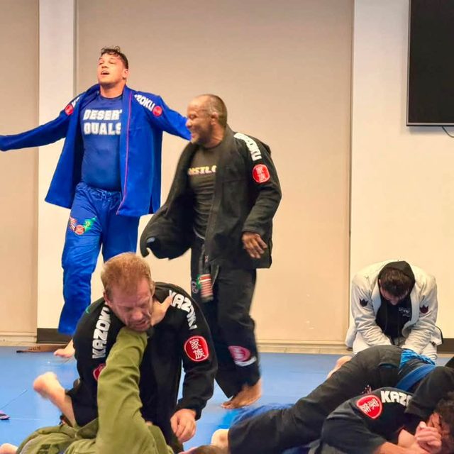 Two training partners share a laugh between rounds