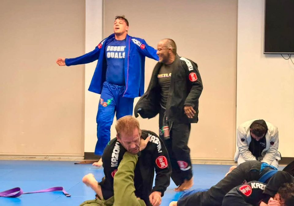 Two training partners share a laugh between rounds
